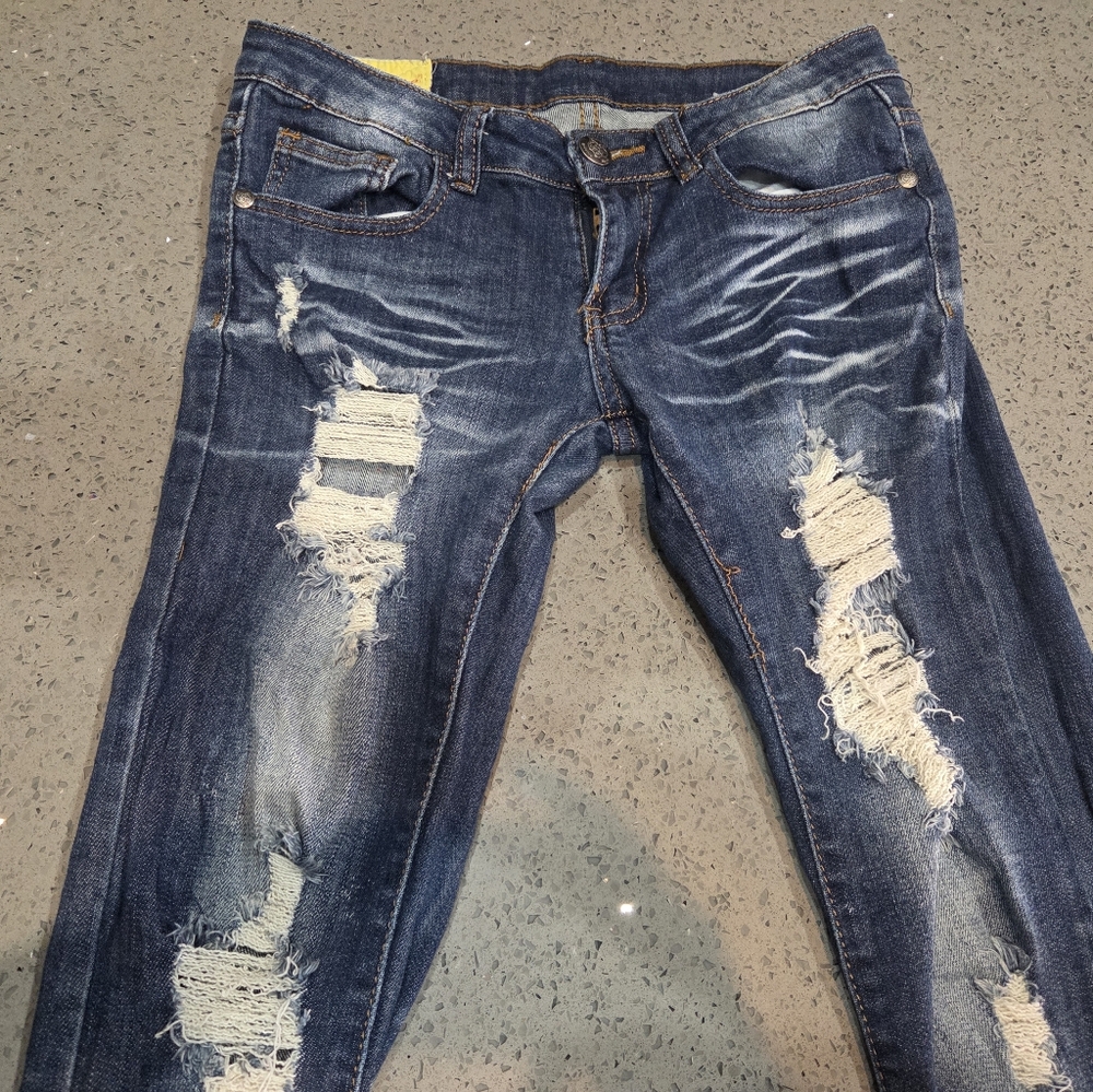 Machine Distressed Blue Jeans